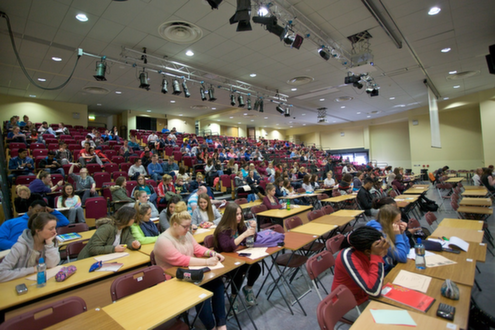 Students at a seminar in the auditorium Students at a seminar in the auditorium