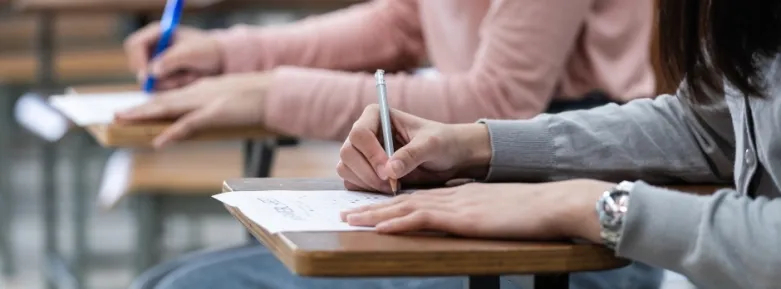 How To Deal With Exam Stress - Woman Writing Exam