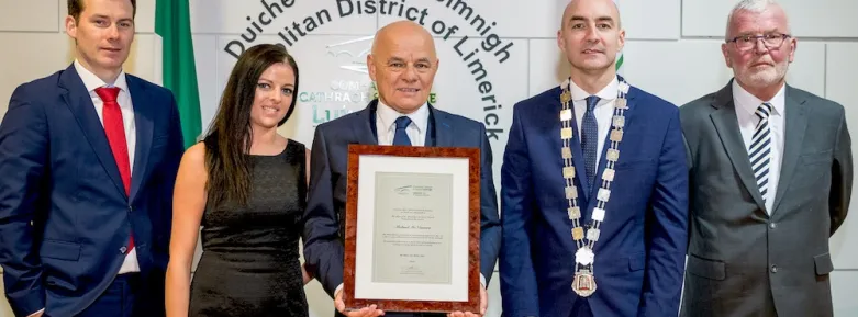 Michael McNamara receives a scroll from the Mayor of Limerick, Daniel Butler (Photo credit: Keith Wiseman)