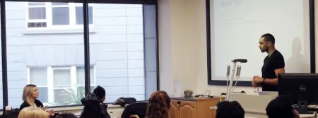 Guest lecturer Kareem Mostafa presents to the Graduate Business School students