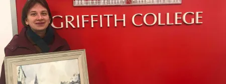 Tetiana Milshyna and her painting at Griffith College Cork