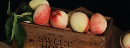A box of fruit against a dark background