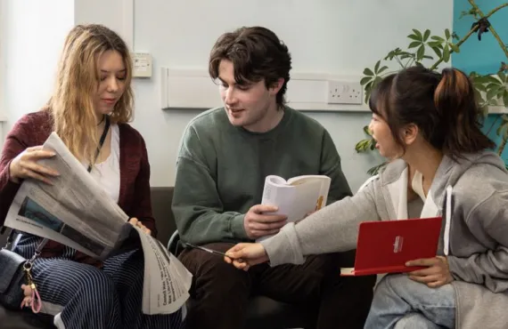 Students working on a project in the library