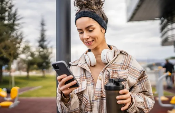 Woman on phone - The five best apps for university students to improve productivity