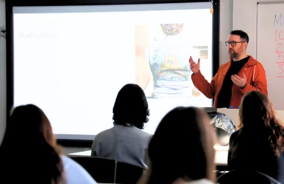 a man presenting to a classroom