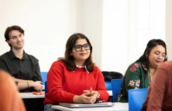 a group of people sitting at a table