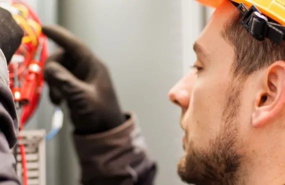 a close up of a man wearing a hat