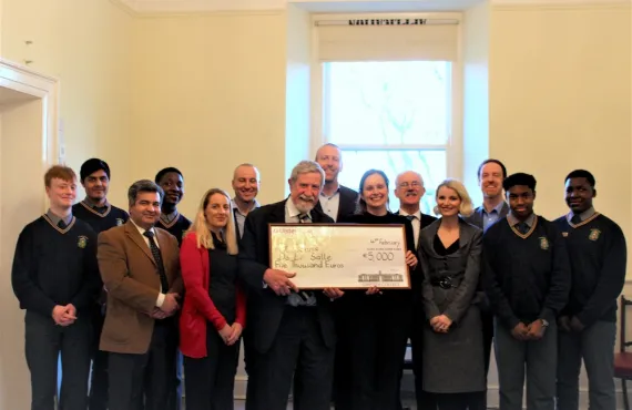 Professor Diarmuid Hegarty poses with staff members and representatives of the winning school, handing them a cheque for €5000