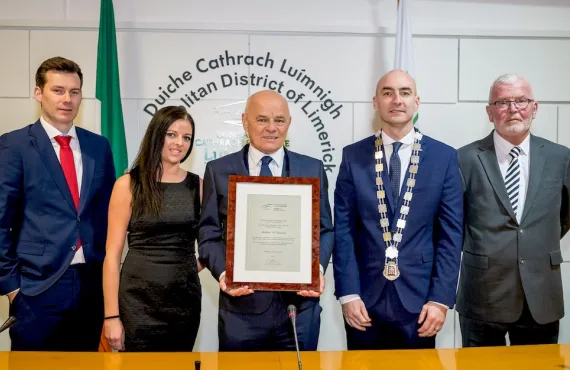 Michael McNamara receives a scroll from the Mayor of Limerick, Daniel Butler (Photo credit: Keith Wiseman)