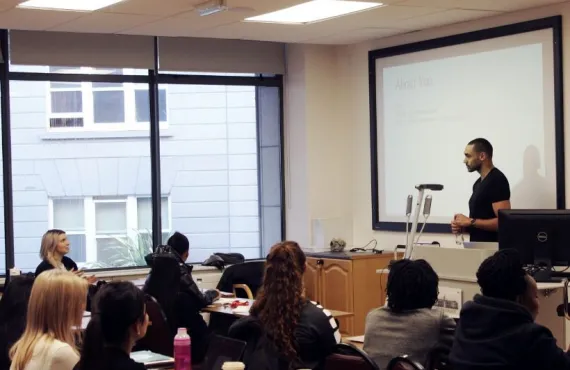 Guest lecturer Kareem Mostafa presents to the Graduate Business School students