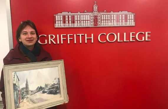 Tetiana Milshyna and her painting at Griffith College Cork
