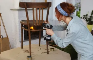 woman fixing chair