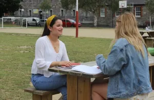 CAO students sitting at bench
