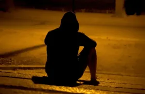 HECA Loneliness man sitting alone