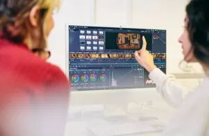 a person standing in front of a computer
