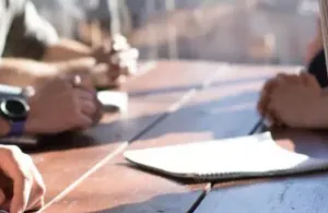 a close up of a person sitting on a table