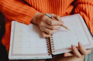 a hand holding a piece of paper