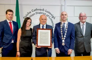 Michael McNamara receives a scroll from the Mayor of Limerick, Daniel Butler (Photo credit: Keith Wiseman)