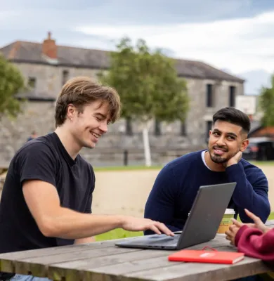 Students smiling outside