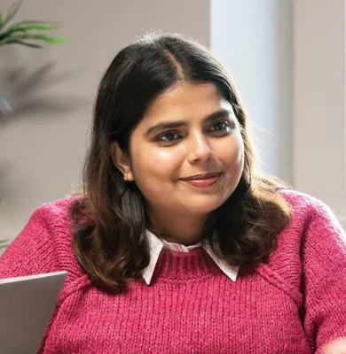 a woman wearing a pink shirt