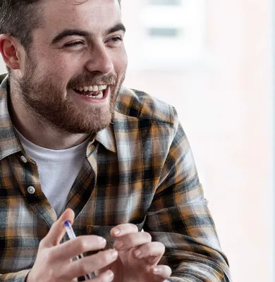 a man standing in front of a window