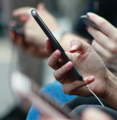 a close up of a person holding a guitar