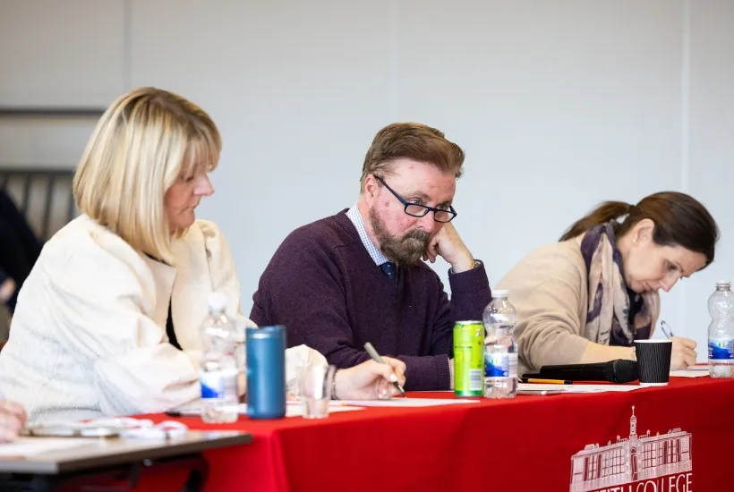 a group of people sitting at a table