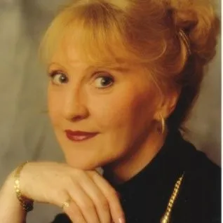 a woman holding her hand to her face