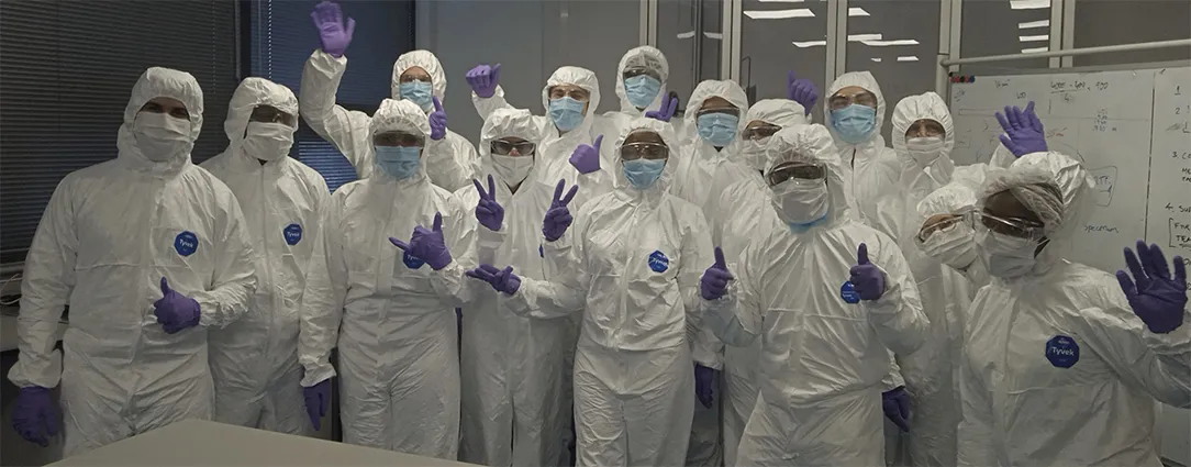 Students in full cleanroom attire during a practical session focused on garbing, contamination control and GMP