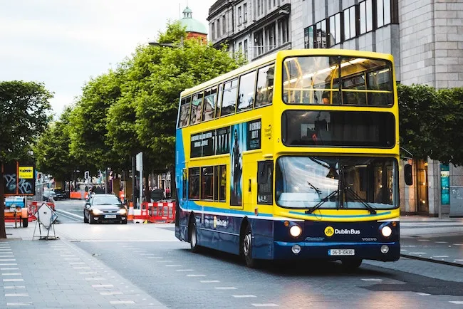 A Dublin bus traveling through the city