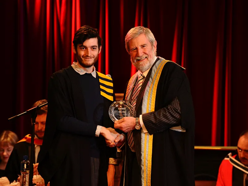 Diarmuid Hegarty Hands parchment to student
