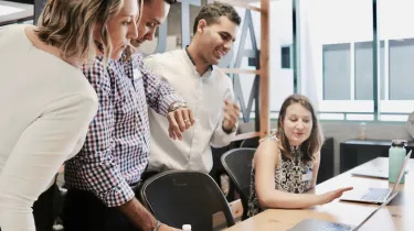 a man and a woman sitting on a table
