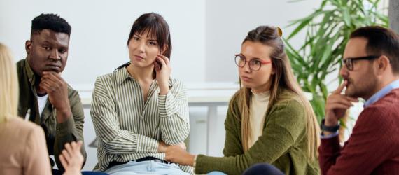 a group of people sitting at a table