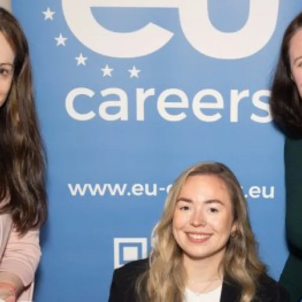 three women posing for the camera