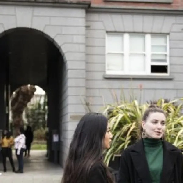 learners standing in front of a building