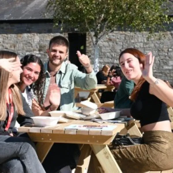 a group of people sitting at a table