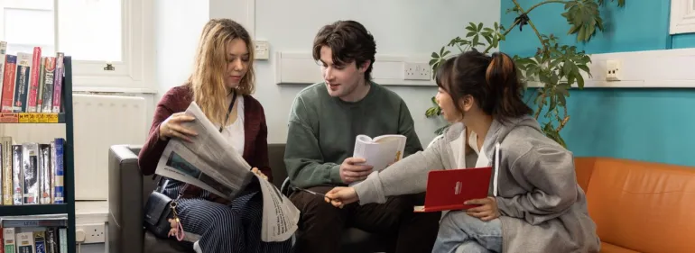 Students working on a project in the library
