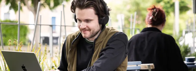 Postgraduate Student studying at laptop