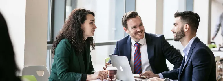 a man and a woman looking at the camera