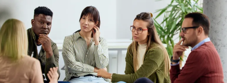 a group of people sitting at a table