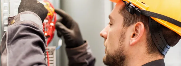 a close up of a man wearing a hat