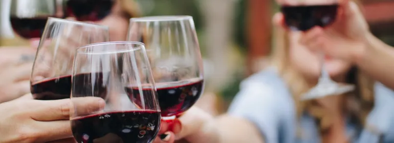 a woman holding a glass of wine