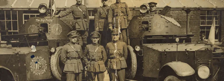 Free State officers in front of armoured cars. Centre in the front row is Tom Ennis, who commanded the National Army takeover of Wellington Barracks. (Courtesy of the National Library of Ireland)