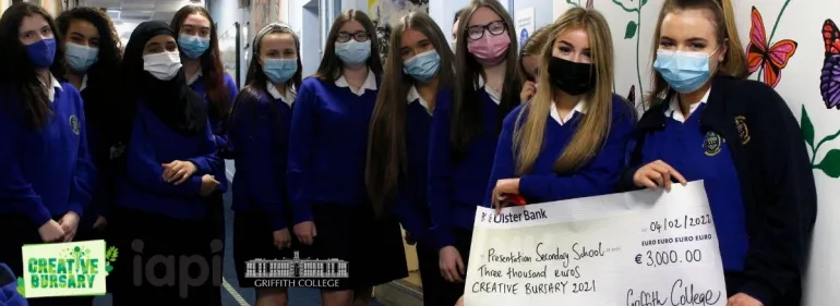 Students being presented with a giant cheque