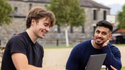 Students smiling outside