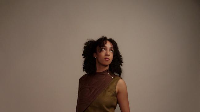 a person standing posing for the camera