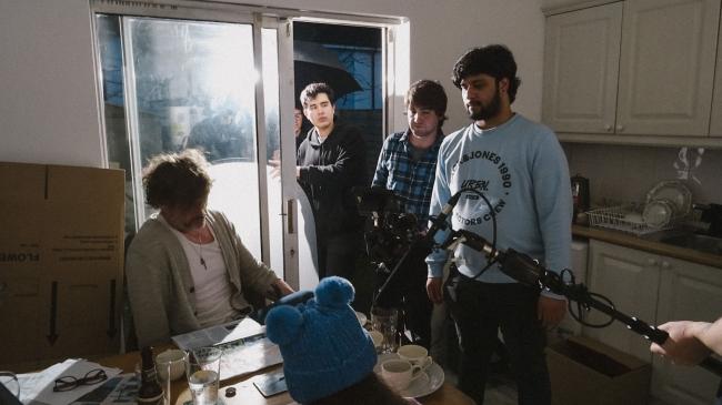 a group of people standing in a room