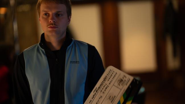 a man in a blue shirt