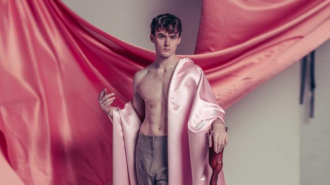 a person wearing a pink garment