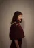 Model wearing shawl with needle felted embellishment on shoulder